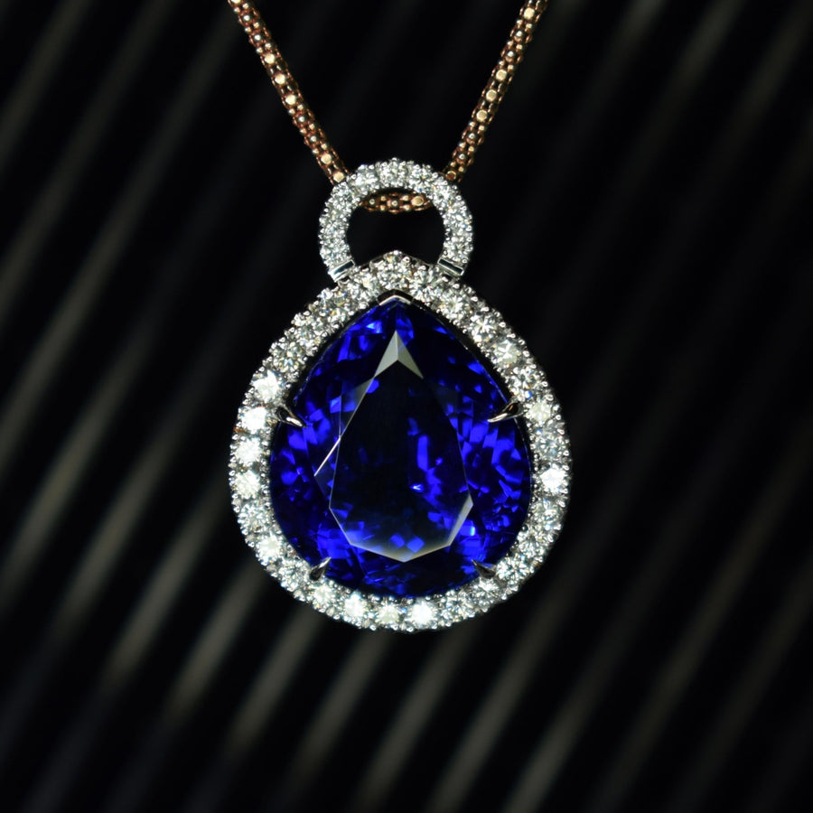 18ct white gold and tanzanite pendant with diamond halo