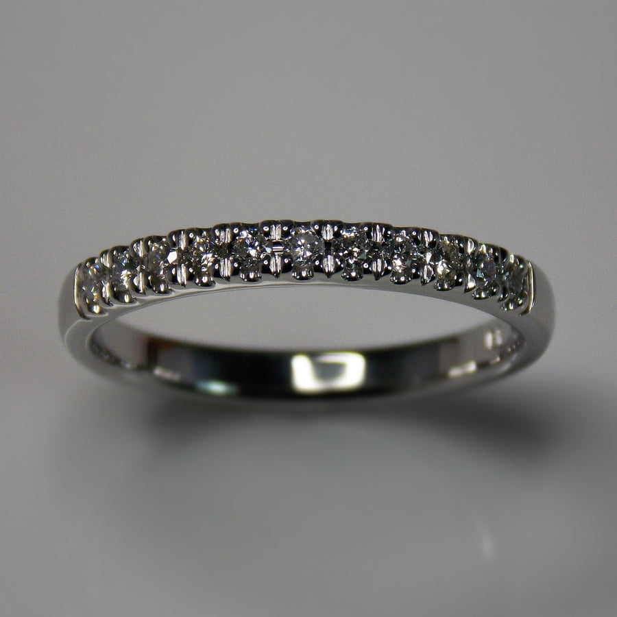 Platinum and diamond half eternity band