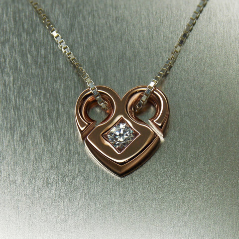 Open heart solitaire diamond pendant in 18K rose gold
