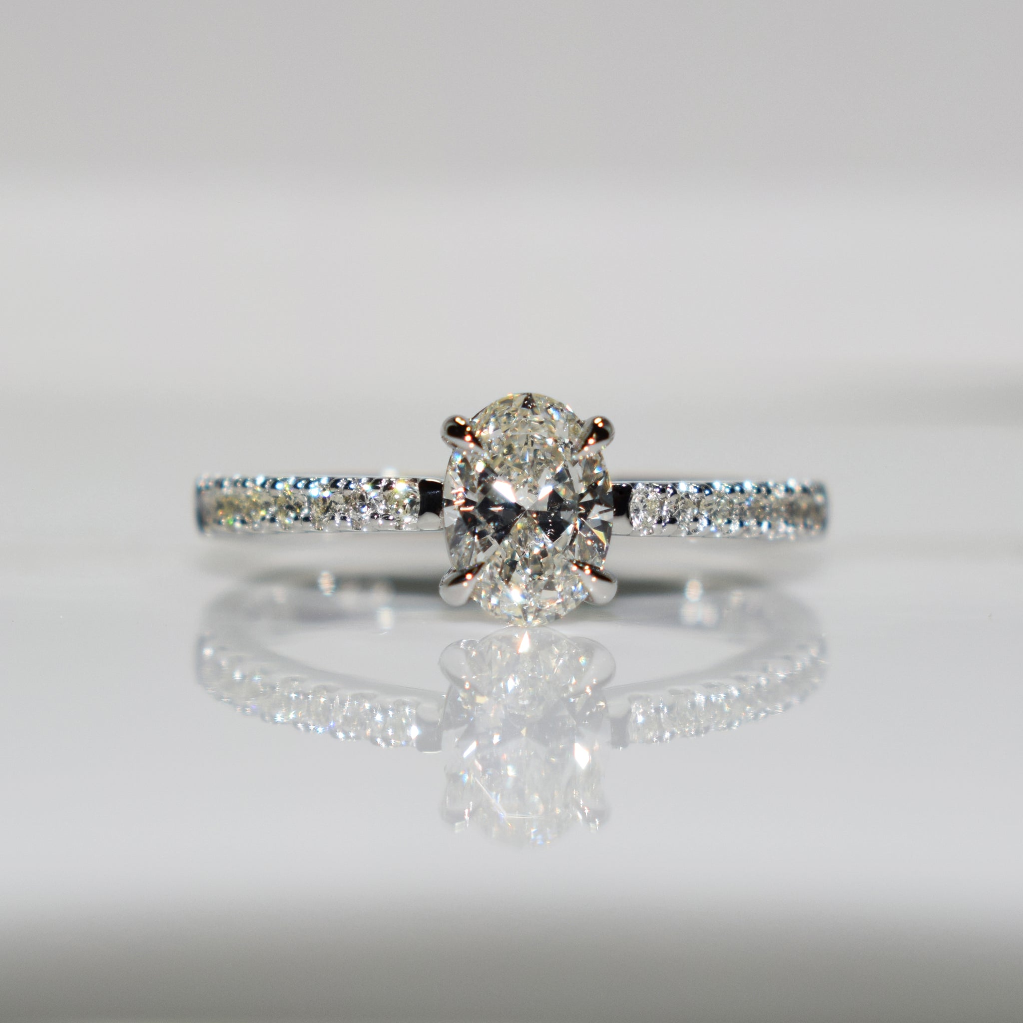 Oval diamond solitaire set with eagle claws in platinum